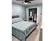 Bedroom with neutral color palette, light walls, and a washer and dryer behind folding doors at 4511 3Rd Street W Cir # 289, Bradenton, FL 34207