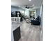 Open living area with modern furnishings, light blue walls and access to the lanai at 4511 3Rd Street W Cir # 289, Bradenton, FL 34207