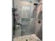 Modern shower features glass doors, stylish tile surround, and a rain shower head at 4511 3Rd Street W Cir # 289, Bradenton, FL 34207