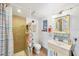 Compact bathroom with shower, decorated with a playful beachside theme at 4528 58Th W St, Bradenton, FL 34210