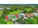 Aerial view of the home, tennis courts, pool and golf course in the community at 4644 Red Maple Rd # 1303, Bradenton, FL 34210