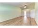 Bright bedroom features wood floors, ceiling fan, and ensuite bathroom access at 4644 Red Maple Rd # 1303, Bradenton, FL 34210