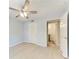 Comfortable bedroom with light blue walls, wood floors, and ensuite bathroom at 4644 Red Maple Rd # 1303, Bradenton, FL 34210