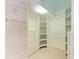 Walk-in closet with built-in shelving and drawers, offering ample storage space at 4644 Red Maple Rd # 1303, Bradenton, FL 34210