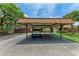 Home exterior showcasing carport and attractive landscaping at 4644 Red Maple Rd # 1303, Bradenton, FL 34210