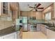 Kitchen featuring stainless steel appliances, granite countertops, custom cabinets, and plenty of workspace at 4644 Red Maple Rd # 1303, Bradenton, FL 34210