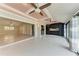 Bright living area featuring tile floors, ceiling fans, and an open layout to kitchen and living spaces at 4644 Red Maple Rd # 1303, Bradenton, FL 34210