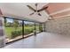 Bright and spacious room featuring tiled floors, ceiling fans, and a view of the backyard landscape at 4644 Red Maple Rd # 1303, Bradenton, FL 34210