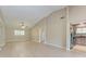 Living room featuring neutral walls, hardwood floors and an entry door and partial view of the kitchen at 4644 Red Maple Rd # 1303, Bradenton, FL 34210