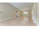 Living room featuring neutral walls, ceiling fan, hardwood floors and an entry door to the house at 4644 Red Maple Rd # 1303, Bradenton, FL 34210