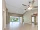 Bright living room featuring neutral walls, ceiling fan, hardwood floors and views of the screened in porch at 4644 Red Maple Rd # 1303, Bradenton, FL 34210