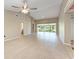 Bright living room featuring neutral walls, hardwood floors and views of the screened in porch at 4644 Red Maple Rd # 1303, Bradenton, FL 34210
