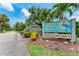 Timber Creek Condominiums sign featuring lush landscaping and blue heron at 4644 Red Maple Rd # 1303, Bradenton, FL 34210