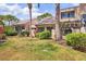 Lush backyard of a home with well-manicured lawn and landscaping at 5273 Myrtle Wood # 37, Sarasota, FL 34235