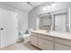 Bright bathroom featuring a vanity, toilet, and shower with safety bar at 5273 Myrtle Wood # 37, Sarasota, FL 34235