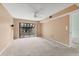 A bedroom with neutral-colored walls and large sliding glass doors to the patio at 5273 Myrtle Wood # 37, Sarasota, FL 34235