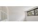 A bright bedroom with shuttered windows and a single window at 5273 Myrtle Wood # 37, Sarasota, FL 34235