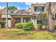 Exterior view of a home with well-maintained lawn and mature landscaping at 5273 Myrtle Wood # 37, Sarasota, FL 34235