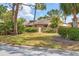Landscaped townhouse with a courtyard, trees, and a cozy, inviting ambiance at 5273 Myrtle Wood # 37, Sarasota, FL 34235