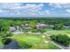 Overhead view of The Meadows golf course with a lush green and surrounding trees and ponds at 5273 Myrtle Wood # 37, Sarasota, FL 34235