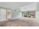Living room featuring neutral carpet, and large windows with natural light at 5273 Myrtle Wood # 37, Sarasota, FL 34235