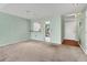 Open-plan living room leading to a kitchen with breakfast bar at 5273 Myrtle Wood # 37, Sarasota, FL 34235