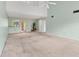 Bright living room with vaulted ceilings, a fan, and a view into the kitchen at 5273 Myrtle Wood # 37, Sarasota, FL 34235