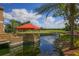 Outdoor seating area on a dock overlooking the water and golf course at The Meadows at 5273 Myrtle Wood # 37, Sarasota, FL 34235