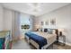Bright bedroom with twin beds, scenic window view, and charming decor at 5320 Layton Dr, Venice, FL 34293