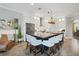 Bright, open kitchen with a large island, pendant lighting, and stainless steel appliances at 5320 Layton Dr, Venice, FL 34293