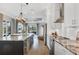 Spacious kitchen with a granite island, stainless steel appliances, and a seamless flow to the living area at 5320 Layton Dr, Venice, FL 34293