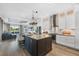 Modern kitchen featuring a large island with seating, stainless steel appliances, and stylish cabinetry at 5320 Layton Dr, Venice, FL 34293