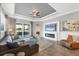 Elegant living room with hardwood floors, fireplace, stylish furniture, and sliding door access to outdoor space at 5320 Layton Dr, Venice, FL 34293