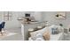 Open floor plan with a kitchen island, breakfast bar, and seamless connection to living area at 5521 Colfax Ter, Port Charlotte, FL 33981