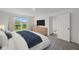 Comfortable main bedroom featuring a large window, television, and neutral decor at 5521 Colfax Ter, Port Charlotte, FL 33981