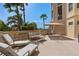 Sunny balcony featuring outdoor seating and an umbrella table at 5531 Cannes Cir # 201, Sarasota, FL 34231
