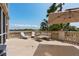 Spacious balcony featuring lounge furniture, dining set and umbrella at 5531 Cannes Cir # 201, Sarasota, FL 34231