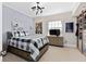 Modern bedroom with plaid bedding, stylish lighting and built in closet and dresser at 5531 Cannes Cir # 201, Sarasota, FL 34231