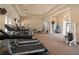 A spacious fitness center with treadmills and weight machines for a complete workout at 5531 Cannes Cir # 201, Sarasota, FL 34231