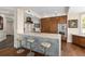 Modern kitchen boasts a center island with seating, sleek appliances, and marble countertops at 5531 Cannes Cir # 201, Sarasota, FL 34231