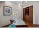 Office with light walls, modern lighting and wood floors plus built-in storage at 5531 Cannes Cir # 201, Sarasota, FL 34231