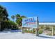 Siesta Beach sign with #1 Beach in the USA set against a backdrop of beautiful sand and clear skies at 5531 Cannes Cir # 201, Sarasota, FL 34231