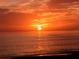 Breathtaking sunset over the ocean, featuring vibrant orange hues and reflective waters at 5531 Cannes Cir # 201, Sarasota, FL 34231