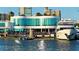 Upscale waterfront dining with floor to ceiling windows, outdoor seating and luxury yacht at 5531 Cannes Cir # 201, Sarasota, FL 34231