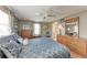 Comfortable bedroom features wood floors and a classic wooden dresser at 5619 Bayshore Rd # 164, Palmetto, FL 34221