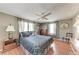 Cozy bedroom featuring a ceiling fan, wood-look floors, and paneled walls at 5619 Bayshore Rd # 164, Palmetto, FL 34221
