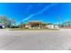 View of community building with a sign, American and Canadian Flags at 5619 Bayshore Rd # 164, Palmetto, FL 34221