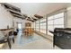 Bright dining area with a fireplace, ceiling fan and lots of natural light at 5619 Bayshore Rd # 164, Palmetto, FL 34221