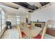 This dining area features a glass-top table, 4 chairs, and fireplace at 5619 Bayshore Rd # 164, Palmetto, FL 34221