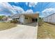 Attractive single-story home with a covered carport and a well-kept lawn at 5619 Bayshore Rd # 164, Palmetto, FL 34221